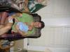 Jeanne and Ethan try not to fall sideways off the chair